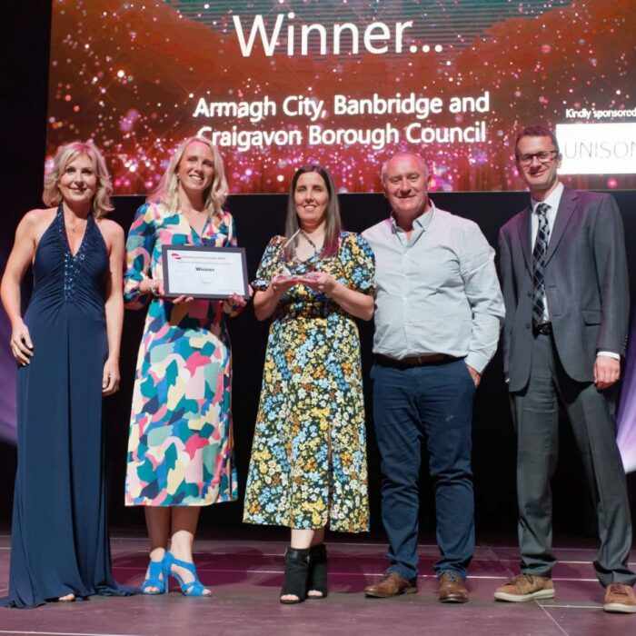 Group of people from Armagh City, Banbridge and Craigavon Borough Council collecting the award.